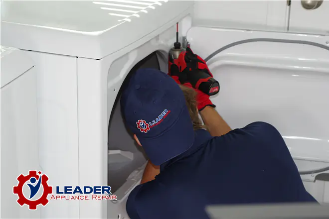 Leader Appliance Repair technician repairing dryer