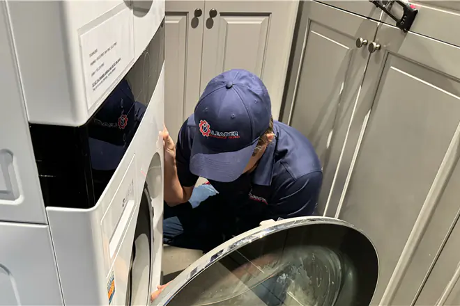 Leader Appliance Repair technician fixing washing machine